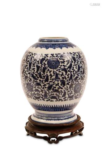 A CHINESE BLUE AND WHITE LANTERN VASE. Qing Dynasty. The domed body decorated with flower heads
