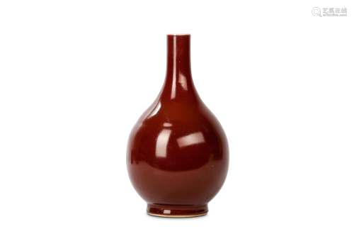 A CHINESE MONOCHROME RED GLAZED VASE. Qing Dynasty, 18th Century. Of pear shaped form raised on a