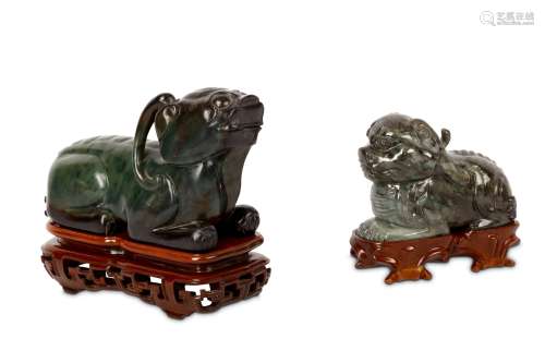 TWO CHINESE JADE ‘QILIN’ CARVINGS. Second half of 20th Century. Each seated with the legs tucked