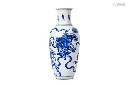 A CHINESE BLUE AND WHITE ‘BUDDHIST LION DOGS’ VASE. Qing Dynasty, Kangxi era. Of baluster form the