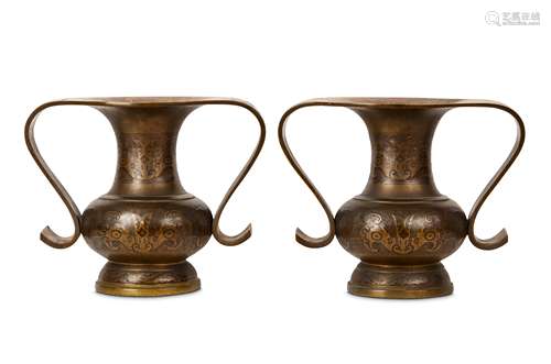 A PAIR OF GILT BRONZE VASE. 19th Century. Of bottle form with S-shaped handles sweeping from the