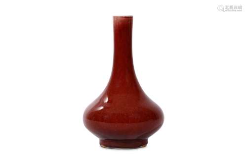 A CHINESE MONOCHROME RED BOTTLE VASE. Qing Dynasty. With a compressed globular body sloping