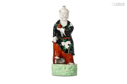 A CHINESE GLAZED PORCELAIN FIGURE OF LI TIEGUAI. Qing Dynasty, 18th Century. The bearded figure