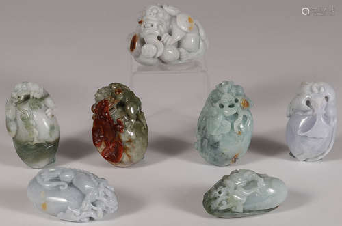 SEVEN FINE CARVED JADE PENDANTS, 19TH CENTURY