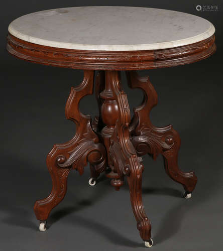 A VICTORIAN WALNUT MARBLE TOP TABLE.