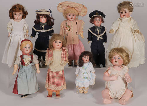 NINE BISQUE HEAD DOLLS