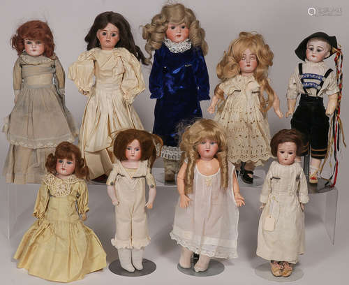 NINE BISQUE HEAD DOLLS