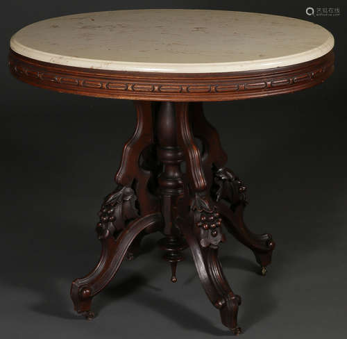 A CARVED VICTORIAN WALNUT LAMP TABLE