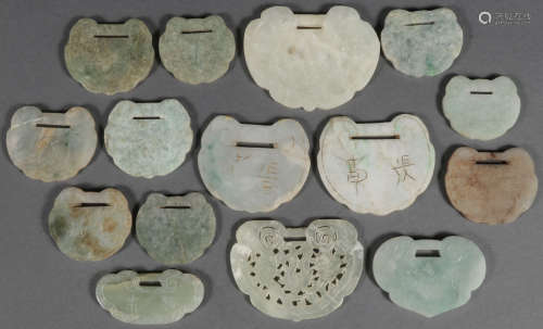 A GROUP OF 15 CHINESE CARVED JADE PENDANTS