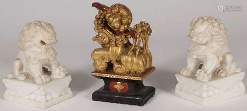 THREE CHINESE CARVED FOO DOGS