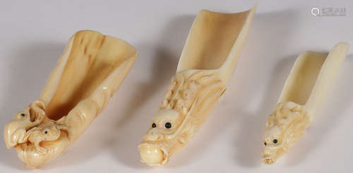 THREE CARVED IVORY TEA SCOOPS