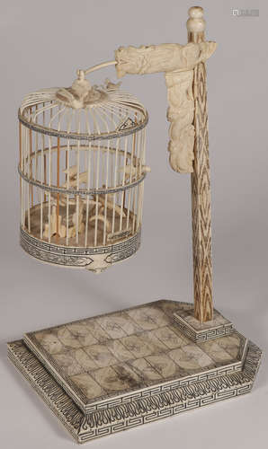 AN ORNATE CARVED CHINESE BONE BIRD CAGE