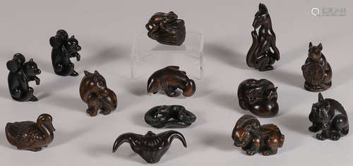 GROUP OF 11 CARVED WOOD NETSUKES, 20TH CENTURY