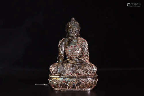 A LABRADORITE SAKYAMUNI FIGURE