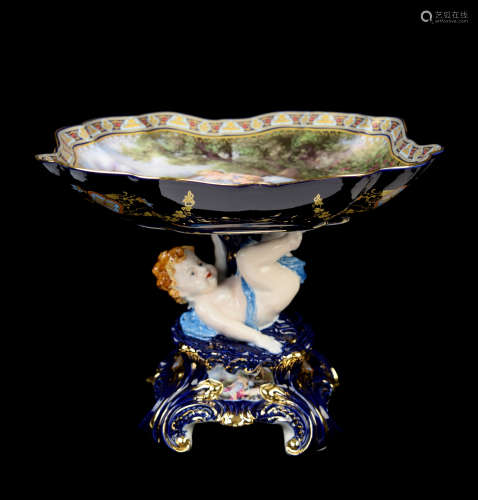 A Continental Indigo Porcelain Floral Edge Compote with Angel Support