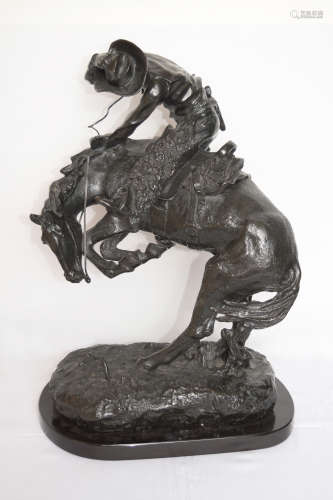 A Bronze Cowboy Sculpture 