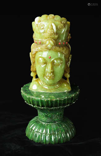 A Chinese Green Jade Guanyin's Head Decorative Ornament on a Spinach Jade Base\