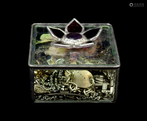 A Stain Glass Jewelry Box with a Flower Handle and its contents