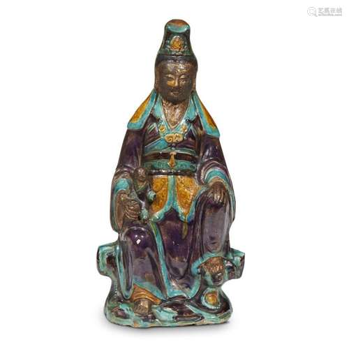 A Chinese glazed and gilded tileworks figure of seated Guanyin with child, ming dynasty