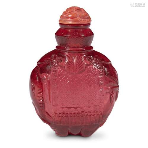 A Chinese carved red glass 