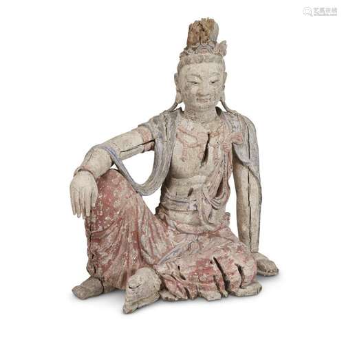 A Chinese carved and painted figure of Guanyin seated , possibly ming dynasty or earlier