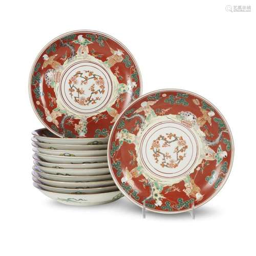 A set of twelve Japanese enameled porcelain orange ground 