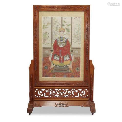 A Chinese portrait of a seated female figure, mounted in a carved and stained hardwood floor screen,