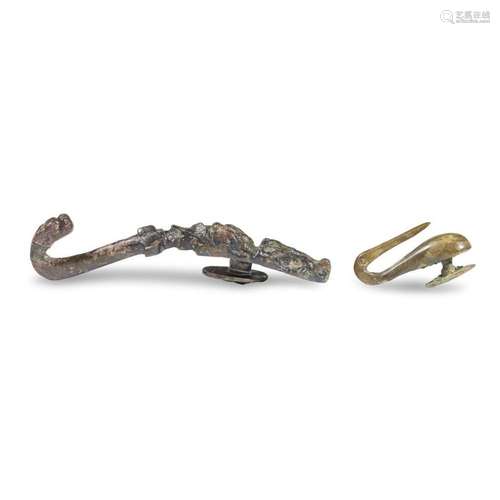 A group of three Chinese bronze belt hooks, warring states or later, and han dynasty