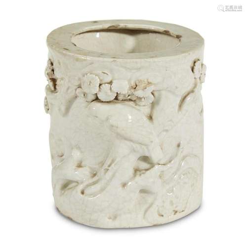 A white-glazed molded, incised and applied porcelain 