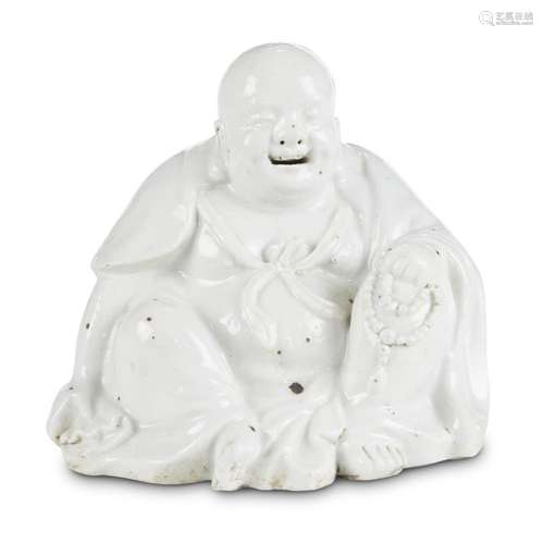 A Chinese blanc de Chine figure of seated Budai, late qing/early republic period