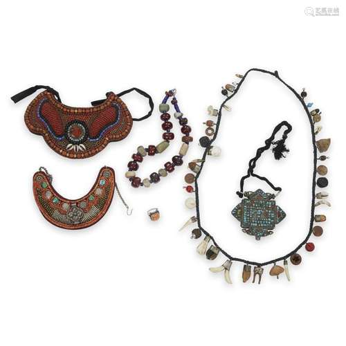 A group of Asian necklaces and neck ornaments,