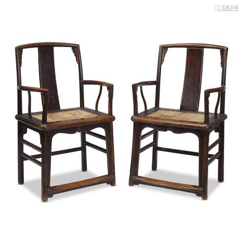 A pair of Chinese Ming-style lacquered wood armchairs,