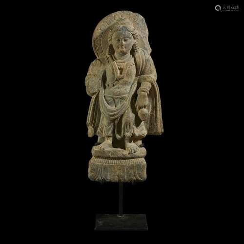 A Gandhara carved grey schist figure of Maitreya standing, 3rd to 5th century