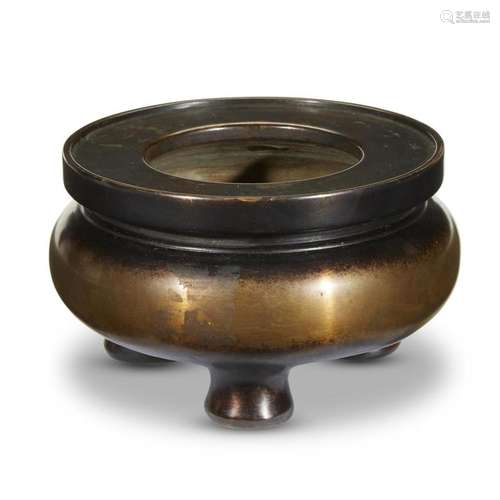 A Chinese patinated bronze tripod censer, xuande mark, probably 18th century