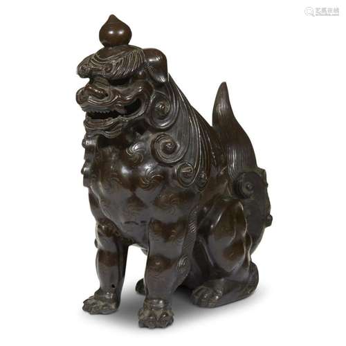 A Japanese patinated and inscribed bronze seated guardian lion, Edo period, inscribed to Kansei 12, Koshin year, corresponding to 1800