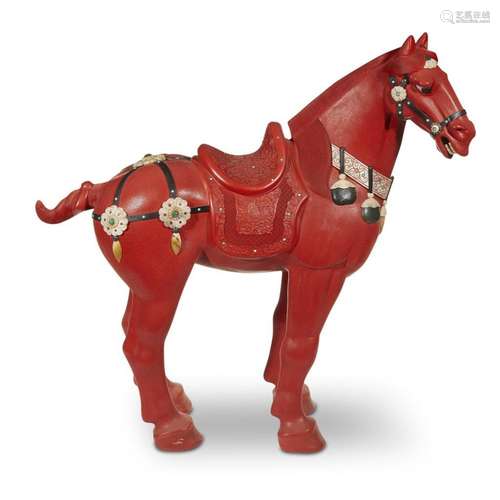 A large Chinese carved and embellished cinnabar lacquer horse,