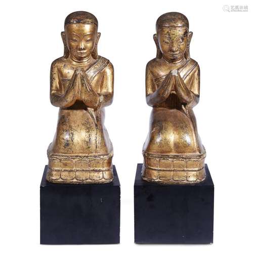 Pair of Southeast Asian gilt composition figures of kneeling attendants, 19th/20th century