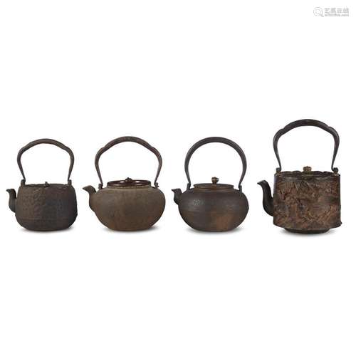 Group of four Japanese cast iron kettles,