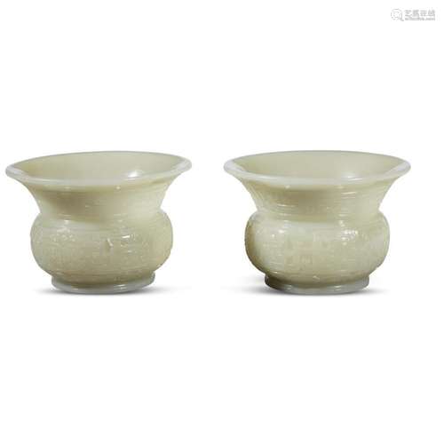 A pair of Chinese carved pale celadon jade archaistic zhadou,