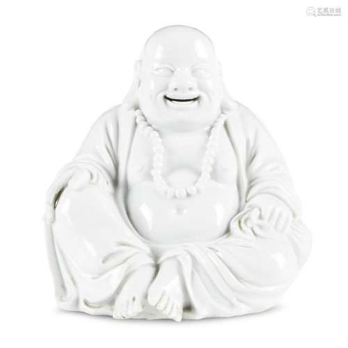 A Chinese blanc de Chine figure of seated Hotei,