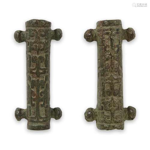 A pair of Chinese archaic bronze fittings, warring states/han dynasty