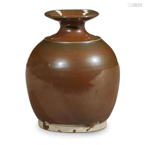 A Chinese persimmon-glazed whiteware jar, song/yuan dynasty