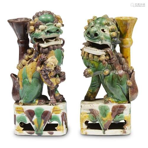 Two sancai-glazed buscuit porcelain Buddhist lion joss-stick holders, possibly Kangxi period