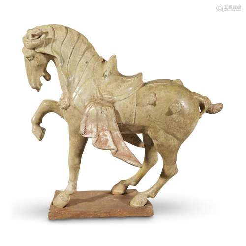 A Chinese straw-glazed pottery figure of a horse, in tang dynasty style