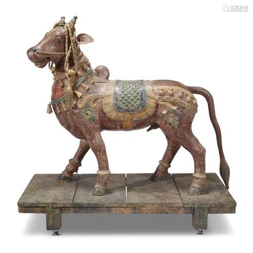 An Indian carved and painted wood figure of a Brahma bull,