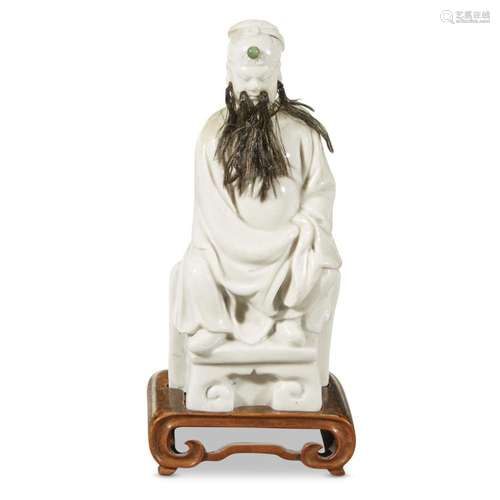 A blanc de Chine figure of seated Guandi, Dehua, qing dynasty, possibly 17th/18th century