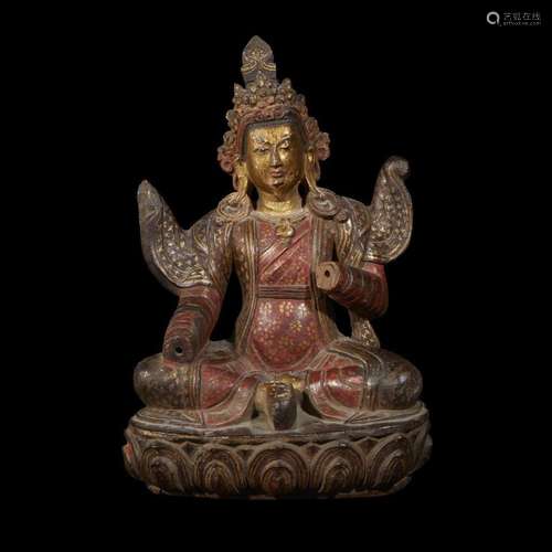 An unsusual carved, painted and parcel gilt figure of a male bodhisattva, probably Tibetan, 17th/18th century