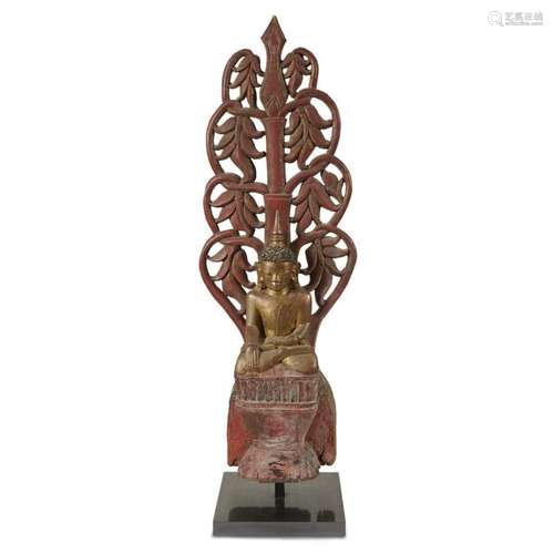 A Lanna style gilt and red-lacquered carved wood figure of Buddha with pierced 