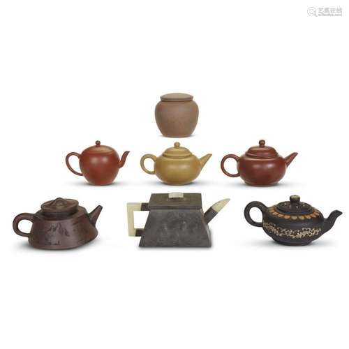 A collection of six small Chinese Yixing teapots and a Chinese stoneware tea caddy, 19th and 20th century