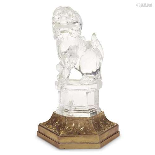 A Chinese carved quartz Buddhist lioness and cub with carved gilt wood stand,